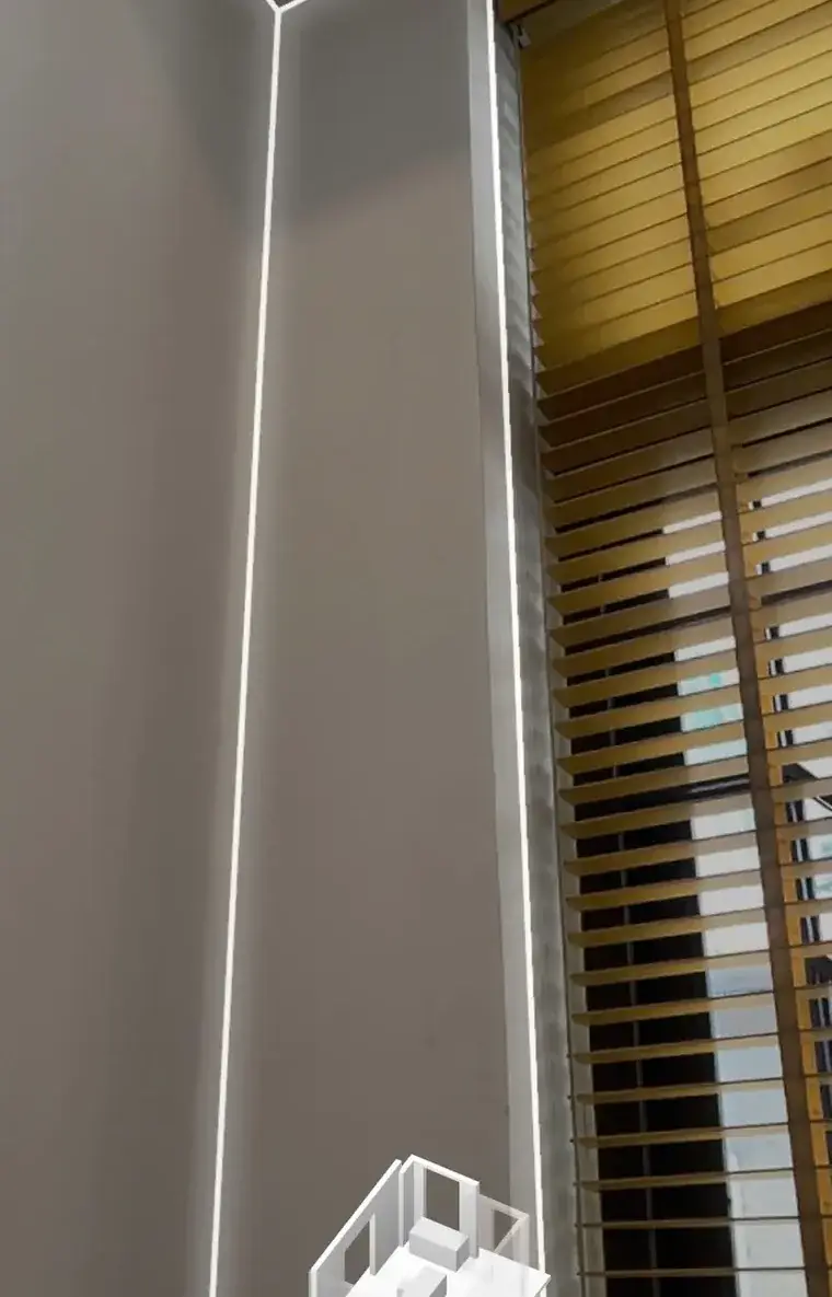 A real LiDAR scanning screen: bright outlines trace the wall edges, ceiling and window frame; a small model of the room builds up at the bottom